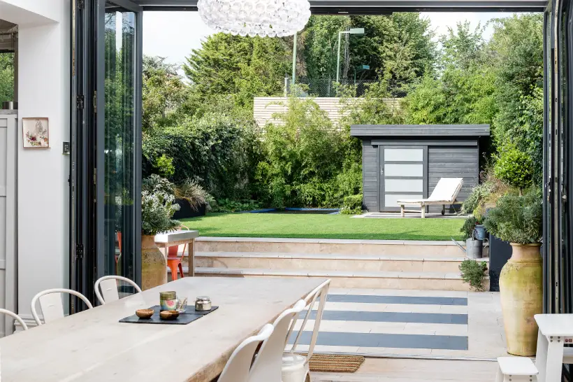 garden design with a sunken trampoline towards the back of the garden